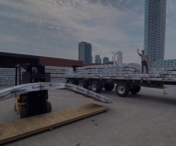 loading composite decks into a truck from an Decks Toronto warehouse